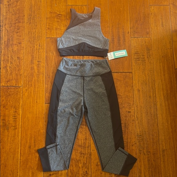 Sports bra and leggings matching set. Grey and black with sheer detailing. NWT - Picture 1 of 7